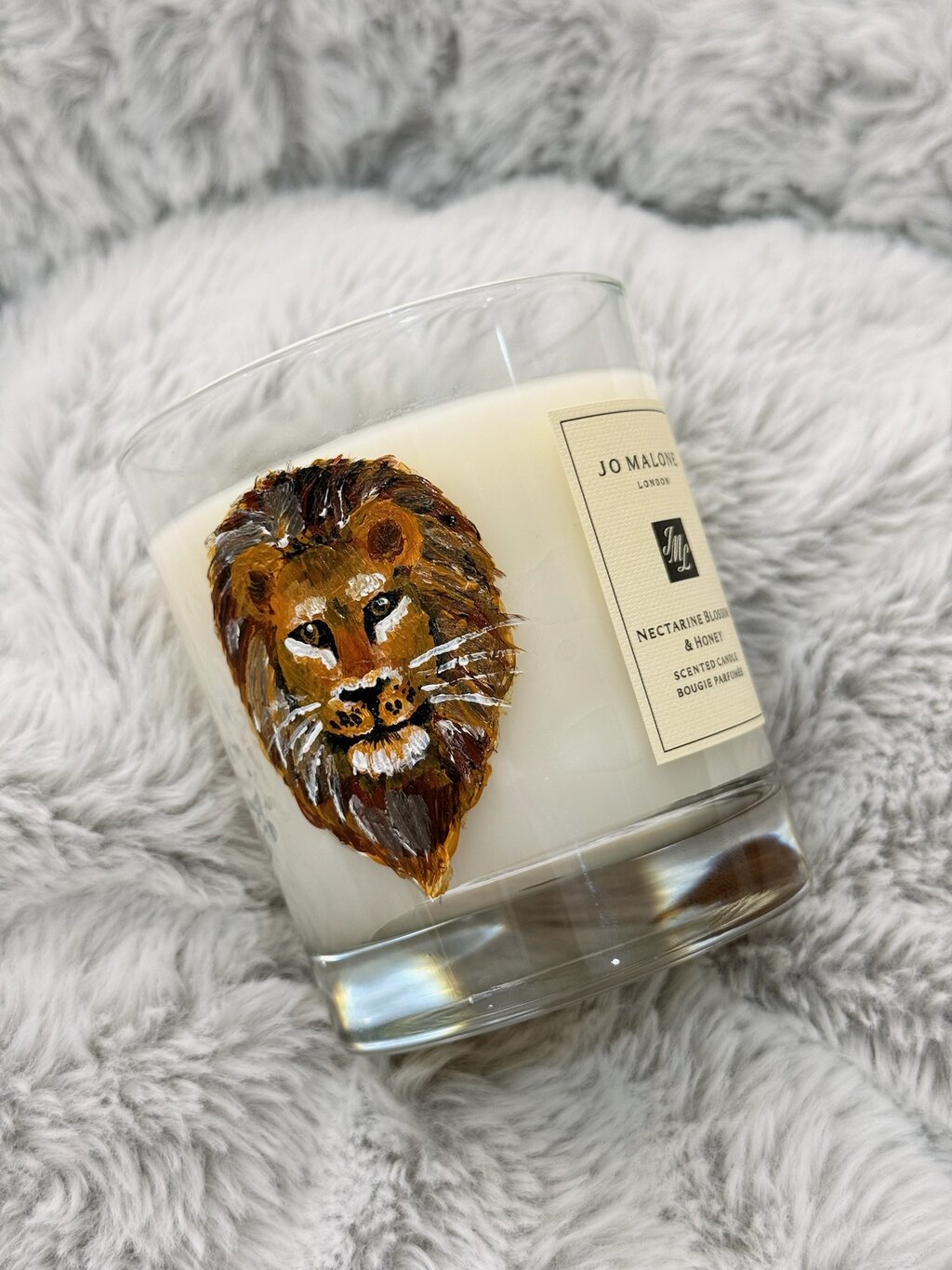Hand-painted lion on Jo Malone candle